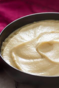 a white bowl filled with cream on top of a pink table cloth and text that reads, smooth as silk cauliflower price