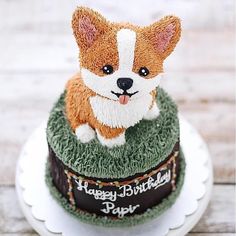 a birthday cake with a dog on top