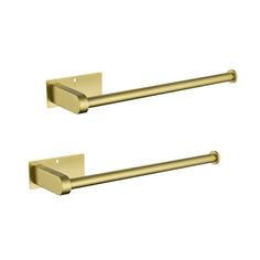 two brass colored handles on the wall