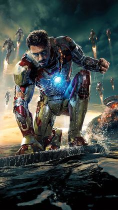 iron man standing in the water with his hands on his hips