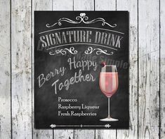 a chalkboard sign that says signature drink happy together with a glass of wine on it