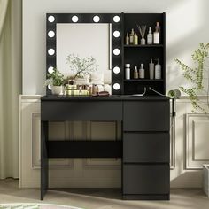 a black vanity with lights on it next to a mirror and shelf filled with bottles