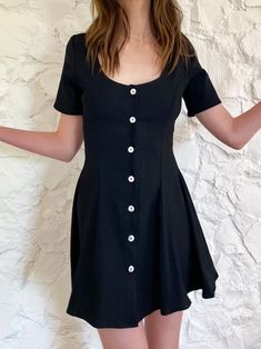 A cute and flouncy fit and flare dress! Button down in mother of pearl. This one is a thicker, slightly stretchy black rayon. All our fabrics are upcycled deadstock. Dry clean only. Black Flowy Dress, Kibbe Romantic, A Line Mini Dress, The Flare, Button Up Dress, Dry Clean Only, Fit Check, Flowy Dress, Character Outfits