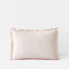 gingham pillow with monogrammed initials on the front and back, in light pink