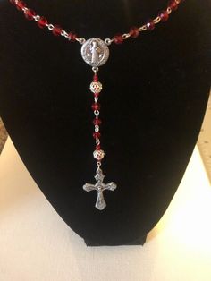 Handmade red rosary with silver accents. Red Rosary Necklace, Handmade Red Crucifix Jewelry, Adjustable Red Cross Necklace, Red Adjustable Cross Necklace, Adjustable Red Rosary With Round Beads, Red Adjustable Rosary With Round Beads, Handmade Red Rosary With Cross, Handmade Red Cross Rosary, Adjustable Red Rosary