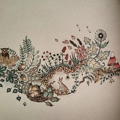 a drawing of flowers and animals on a wall