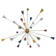 a clock with many different colored arrows on it