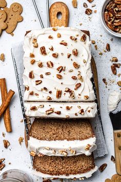 slices of carrot cake with cream cheese frosting and pecans