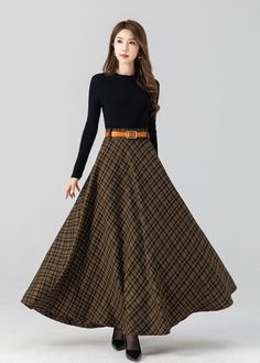 "DETAILS: * 30% wool, 30% fiber, 40% polyester * fully satiny liner * Two side pockets * back zip closure * pleated skirt, circle skirt * High waist skirt * Ankel length skirt * Perfect for Winter, autumn * Lean More about the items From the FAQs on the page bottom * More plaid: https://etsy.me/3OZZf8J MODEL SIZE Bust 85 cm(33.4\")  Waist 67 cm(26.7\")  Height 168cm (5' 6\") She wears size XS CUSTOM MADE SERVICE If you * Change other color * Can't find your size in our size Chart * Change the St Winter Full Length Lined Skirt, Full Length Lined Skirt For Winter, Winter Full-length Pleated Skirt, Winter Pleated Maxi Skirt, Brown Wool Pleated Skirt, Winter Flared Maxi Skirt With Lining, Winter Flowy Lined Maxi Skirt, Fitted Wool Maxi Skirt For Fall, Winter Wool Lined Maxi Skirt