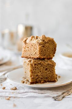 two pieces of cake sitting on top of a white plate