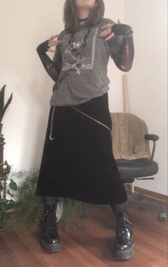 A white mid-size person/girl wearinga gray shirt with a white skeleton and moon print-on, a black lace longsleeve under it, a black velvet maxi skirt, black platform dr. Martens and multiple crystal rings and bracelets. 		The person is also wearing multiple silver necklaces; one in form of a skull, a big cross, and one in form of a moon, a butterfly , a long black bead necklace and a black lace choker. Doc Martens Outfit Goth, Real Goth Outfits, Fit Aesthetic Outfit, Crow Core, Platform Doc Martens, 80s Mom, Goth Cottagecore, Dark Cottage Core