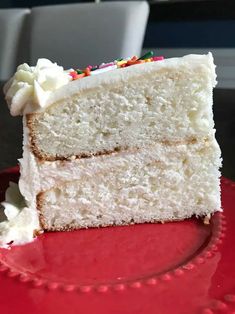 a slice of white cake on a red plate