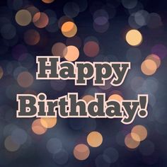 the words happy birthday are displayed in front of blurry boket lights on a dark background