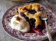 a piece of pie and ice cream on a plate with a fork next to it