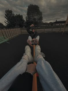 a person sitting on top of a skateboard