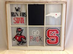 a window with some stickers on it and the words we run this state go pack