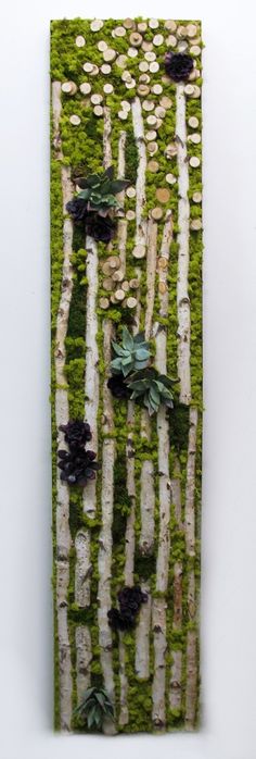 a piece of art made out of moss and rocks