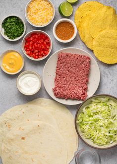 an assortment of ingredients are laid out on the table to be prepared for this meal