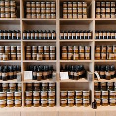 the shelves are filled with many different types of jars