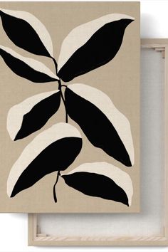 a painting with black and white leaves on it