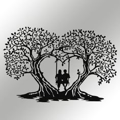 a couple sitting on a swing in the shape of a heart under a tree with leaves