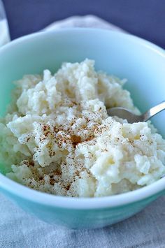 a bowl filled with mashed potatoes on top of a table