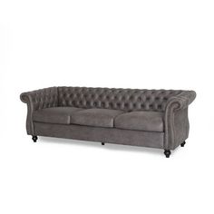 an image of a grey couch with buttons on the armrests and back cushions