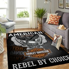 a living room with a couch, chair and rug on the floor that says america harley - davidson cycles