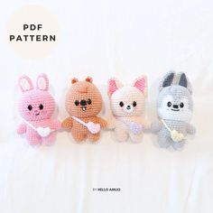 four crocheted stuffed animals lined up on a white sheet