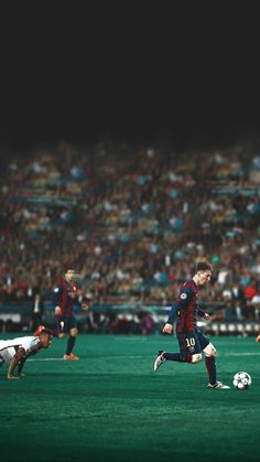 the soccer players are playing on the field in front of an empty stadium full of people