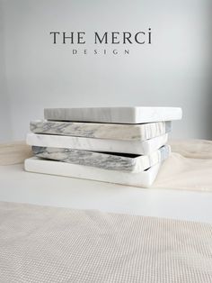 the merci design mattress is stacked on top of each other