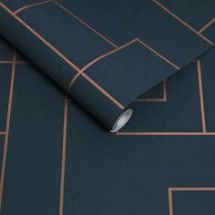 a dark blue and copper wallpaper with geometric lines on the bottom half of it