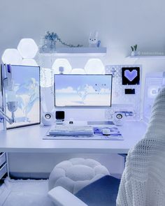 a white desk topped with two computer monitors