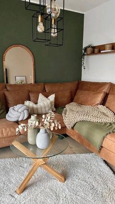 a living room filled with furniture and decor on top of a white carpeted floor