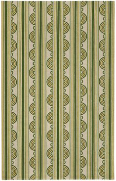 a green and white striped rug with circular designs on it's sides, in the middle