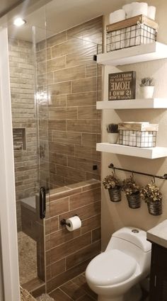 a bathroom with a toilet, shower and shelves