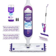 a purple and white electric mop with cleaning supplies next to it on a white background