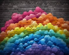 an image of a rainbow painted on the side of a brick wall