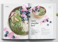 an open magazine with blueberries, kiwis and other food items on it