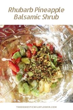 a bowl filled with fruit and nuts on top of a table