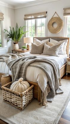 a large bed sitting in a bedroom on top of a wooden floor next to a window