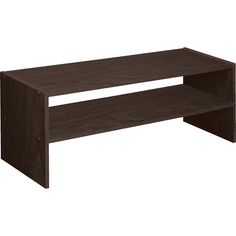 a large wooden shelf sitting on top of a white wall