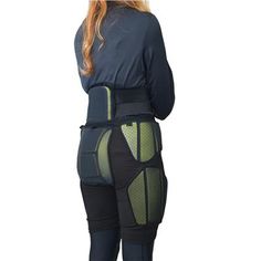 the back view of a woman wearing a black and green body suit