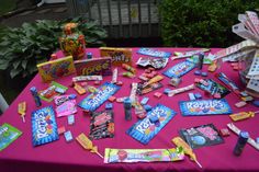 a table topped with candy bars and candies