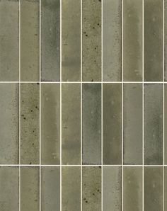 a tile wall with different shades of gray and white