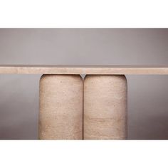 two concrete cylinders sitting on top of each other