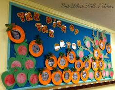 a bulletin board is decorated with pictures and fruit for the school's first day of school