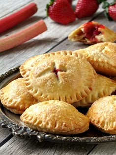 several small pies are on a plate