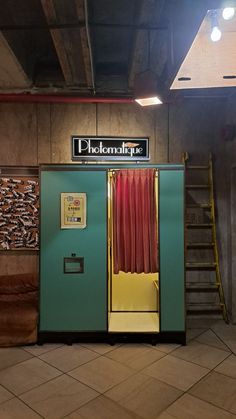 an old fashioned phone booth with red curtains