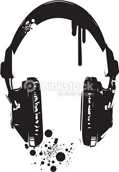 a pair of headphones sitting on top of a white surface with ink splatters